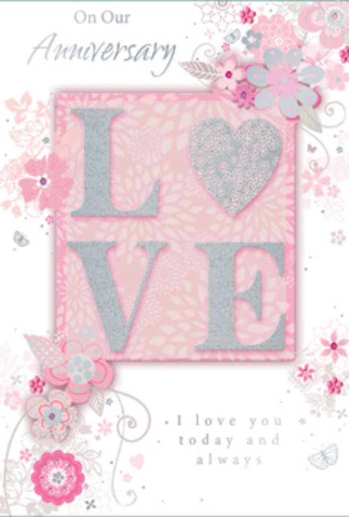 The photograph captures a beautifully detailed anniversary card that seems to echo the refined charm of Knightsbridge's tree-lined avenues and intimate garden squares. At its heart, the word LOVE stands proud in raised, glitter-touched letters, the surface glinting gently in blush pink, frosted white, and hints of silver. The embossing creates tiny shadows along each curve and edge, giving the word a sculpted, almost jewel-like presence against the soft pink background. Around this central emblem, a lyrical pattern of stylised flowers, leaves, and swirling tendrils drifts across the card, as if carried by a light spring breeze. The flowers are rendered in fine, graceful lines, shaded in pale greys and silver tones that sit harmoniously over the pastel backdrop, recalling the delicate planning sketches a florist might make before arranging a romantic bouquet for a Knightsbridge townhouse near Sloane Street or Harrods. The blooms and foliage cluster near the corners and edges, then taper off into airy curls, leaving breathing space around the central message. Subtle variations in pink-from powder blush to soft rose-add depth, while the glitter highlights catch the light like the sheen on fresh petals after rain. Flowing across the card in a poised script, anniversary greetings speak of devotion, gratitude, and years of shared companionship. The overall mood is one of gentle celebration and steady affection, a paper keepsake that would pair beautifully with a hand-tied arrangement prepared by Knightsbridge Flowers for same-day delivery to a partner who treasures style and sentiment in equal measure.